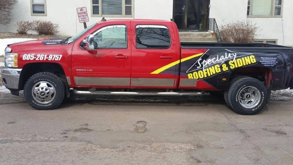 Specialty's red work truck with the company decals.